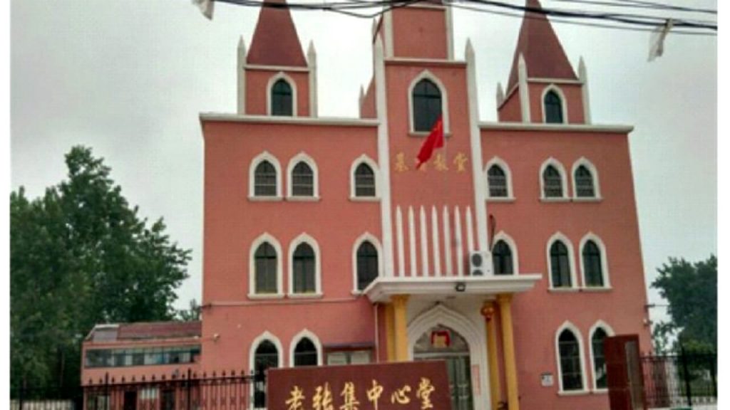 A national flag is raised in front of the Central Church in Laozhangji Town, Huai’an City, Jiangsu Province.