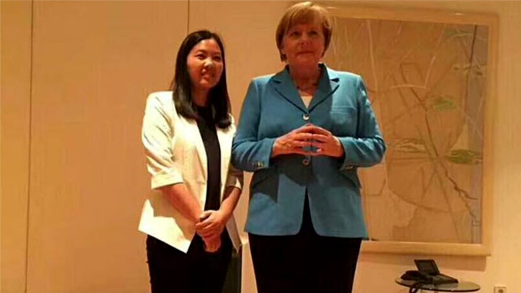 German Chancellor Angela Merkel and Xu Yan, wife of jailed human rights attorney Yu Wensheng, in undated recent photo. Xu Yan