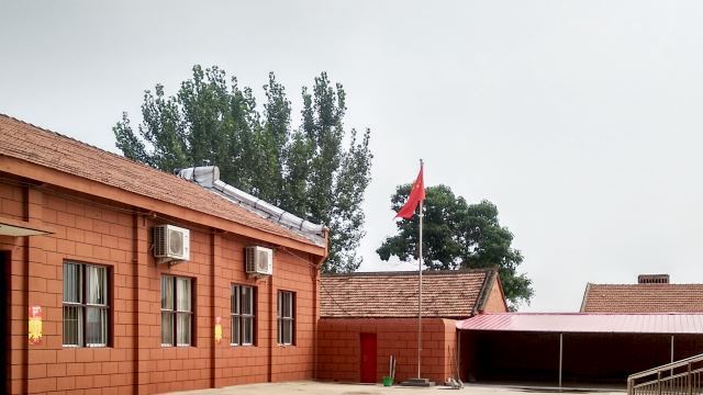 A Chinese flag is erected in the yard of the church in Yangzhuang village.