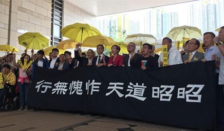 Supporters rally for nine prominent figures of Hong Kong's 2014 Occupy Central pro-democracy movement who went on trial on on public order charges, Nov. 19, 2018.