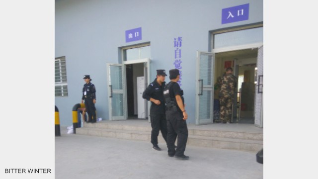 Police patrol and stand guard outside the transformation through education camp.
