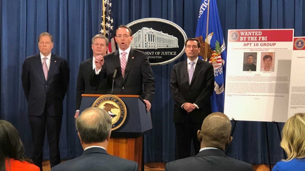 US Deputy Attorney General Rod Rosenstein (C), flanked by US law enforcement offficials, speaks at a press conference after the Justice Department unveiled fresh indictments of Chinese government hackers who allegedly targeted scores of international companies, Washington, DC, Dec. 20, 2018. RFA