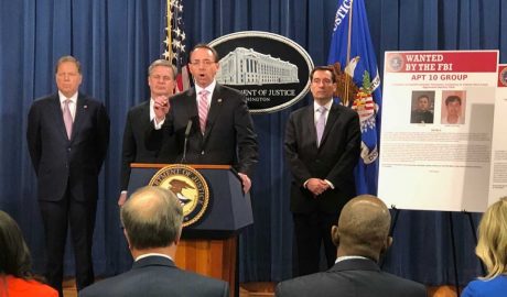 US Deputy Attorney General Rod Rosenstein (C), flanked by US law enforcement offficials, speaks at a press conference after the Justice Department unveiled fresh indictments of Chinese government hackers who allegedly targeted scores of international companies, Washington, DC, Dec. 20, 2018. RFA