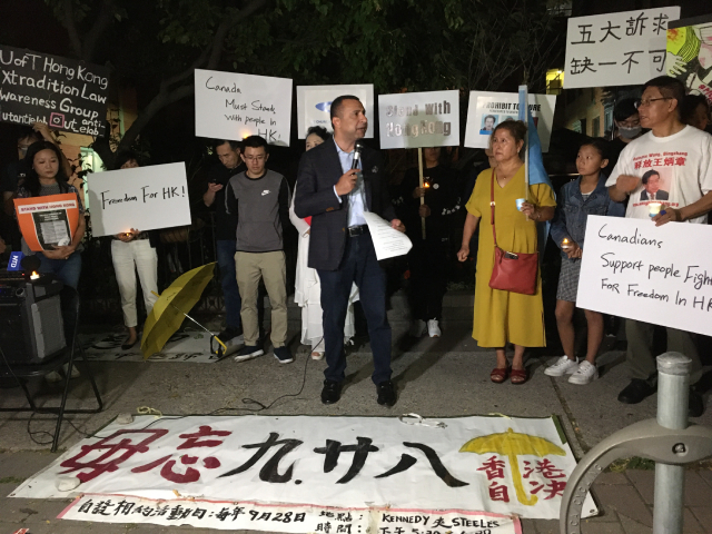 Over a dozen organizations hold a candlelight prayer rally in solidarity with Hong Kong. 