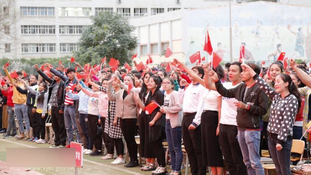 Teachers and students in Xinjiang’s Hotan city pledge allegiance to the Communist Party.