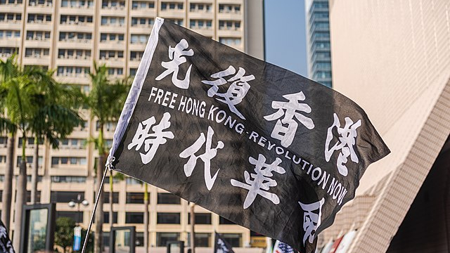 Flags displaying the slogan are often seen at pro-democracy protests.