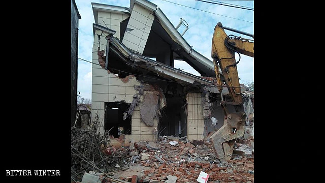 A villager’s house is being destroyed.