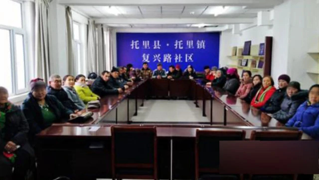 Xinjiang residents participate in an indoctrination class.