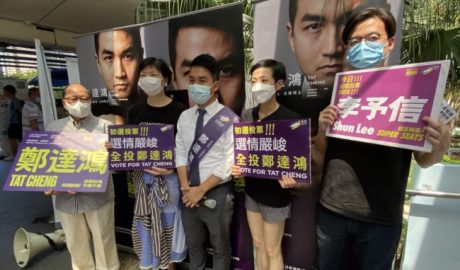 Pro-democracy activists (L-R) Eddie Chu, Gwyneth Ho, Leung Hoi-ching, Tiffany Yuen, Joshua Wong, Sunny Cheung and Lester Shum campaign during primary elections as Hong Kong's pro-democracy parties held weekend primary polls to choose candidates for upcoming legislative elections, July 12, 2020.
