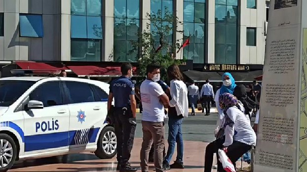 Police detain a group of Uyghurs on Taksim Square in Istanbul, Aug. 17, 2020