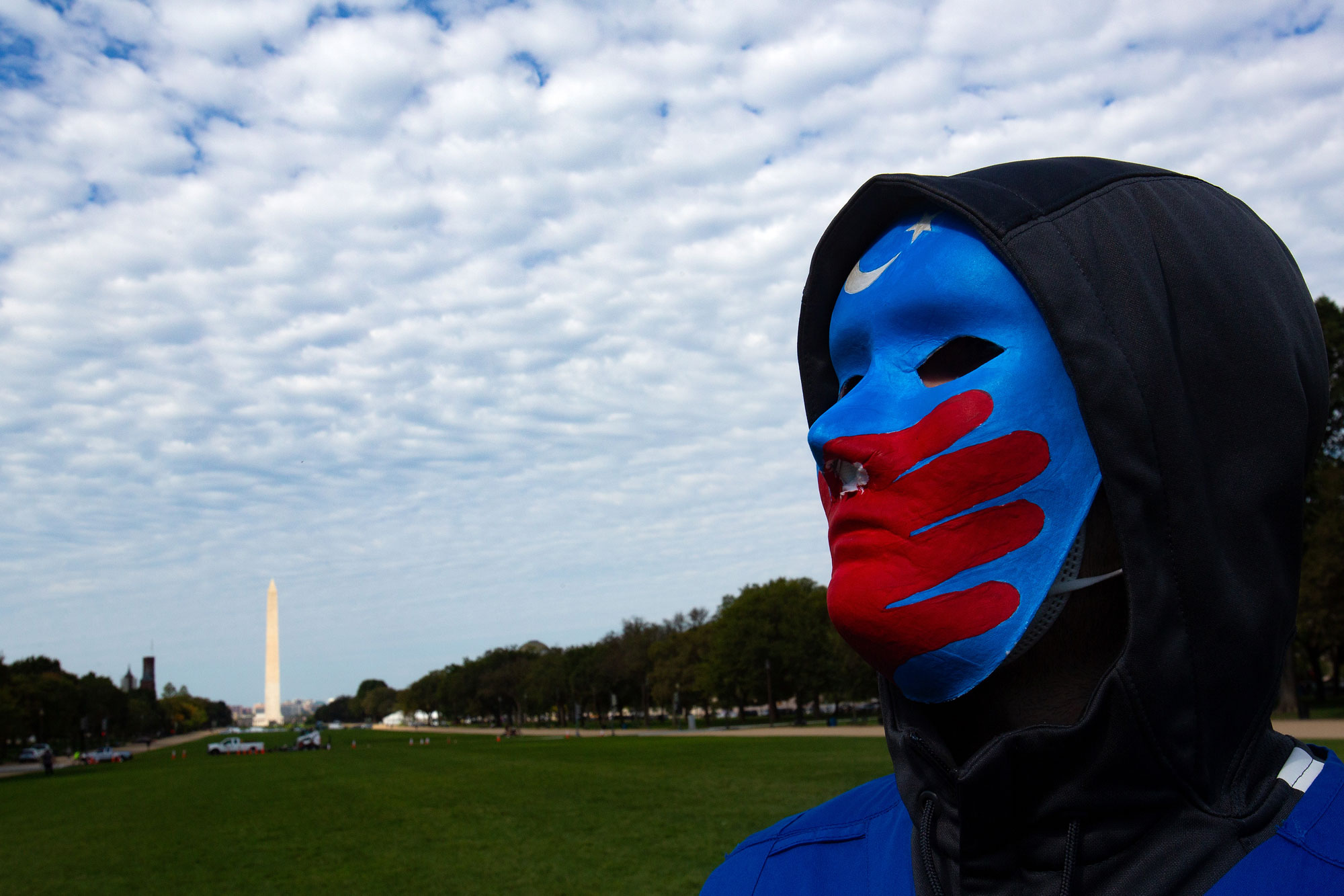 A Uyghur protester participates in "Resist CCP: Global Day of Action" in front of the Capitol Reflecting Pool in Washington D.C., Oct. 1, 2020