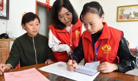Government employees are registering information in a resident’s home in Anhui’s Hefei city.
