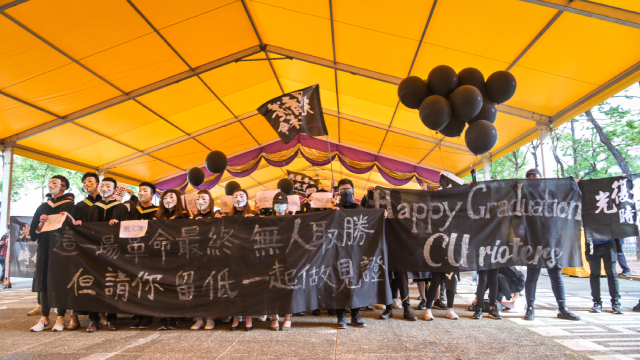 Students from the Chinese University of Hong Kong display slogans now called illegal under the city's new security law, Nov. 19, 2020.